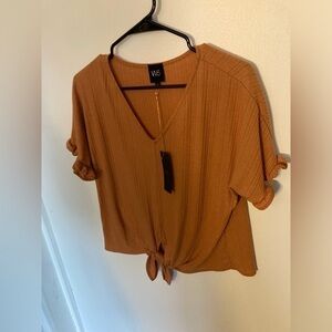 W5 cropped style short sleeve shirt in size medium in an dark orange color. NWT